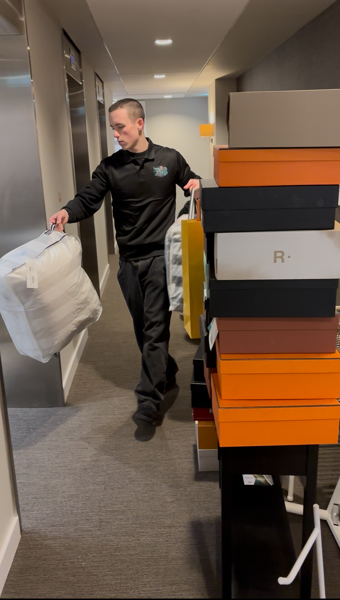 Team member providing service in modern building corridor