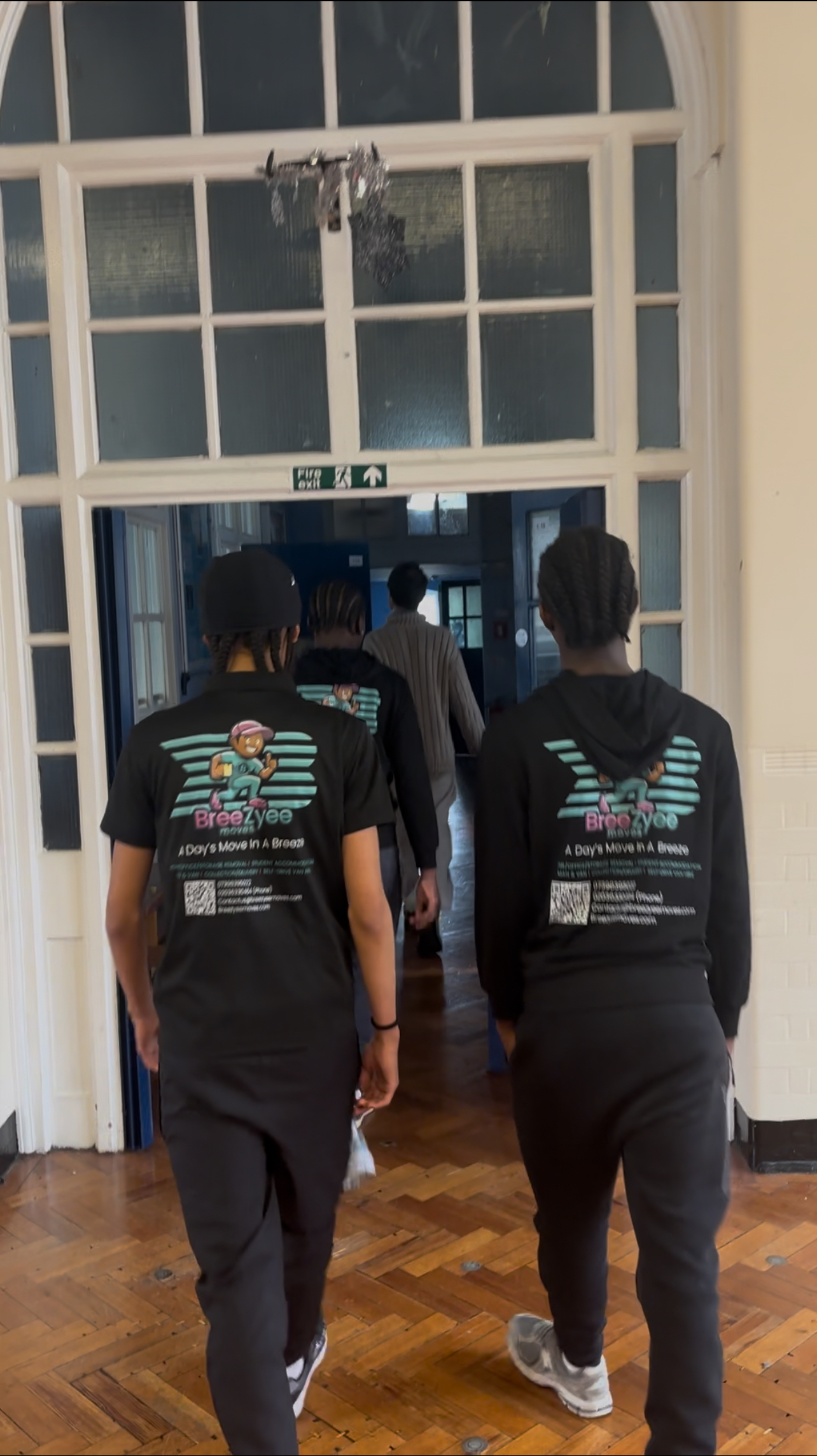 Team members in elegant building with professional branding