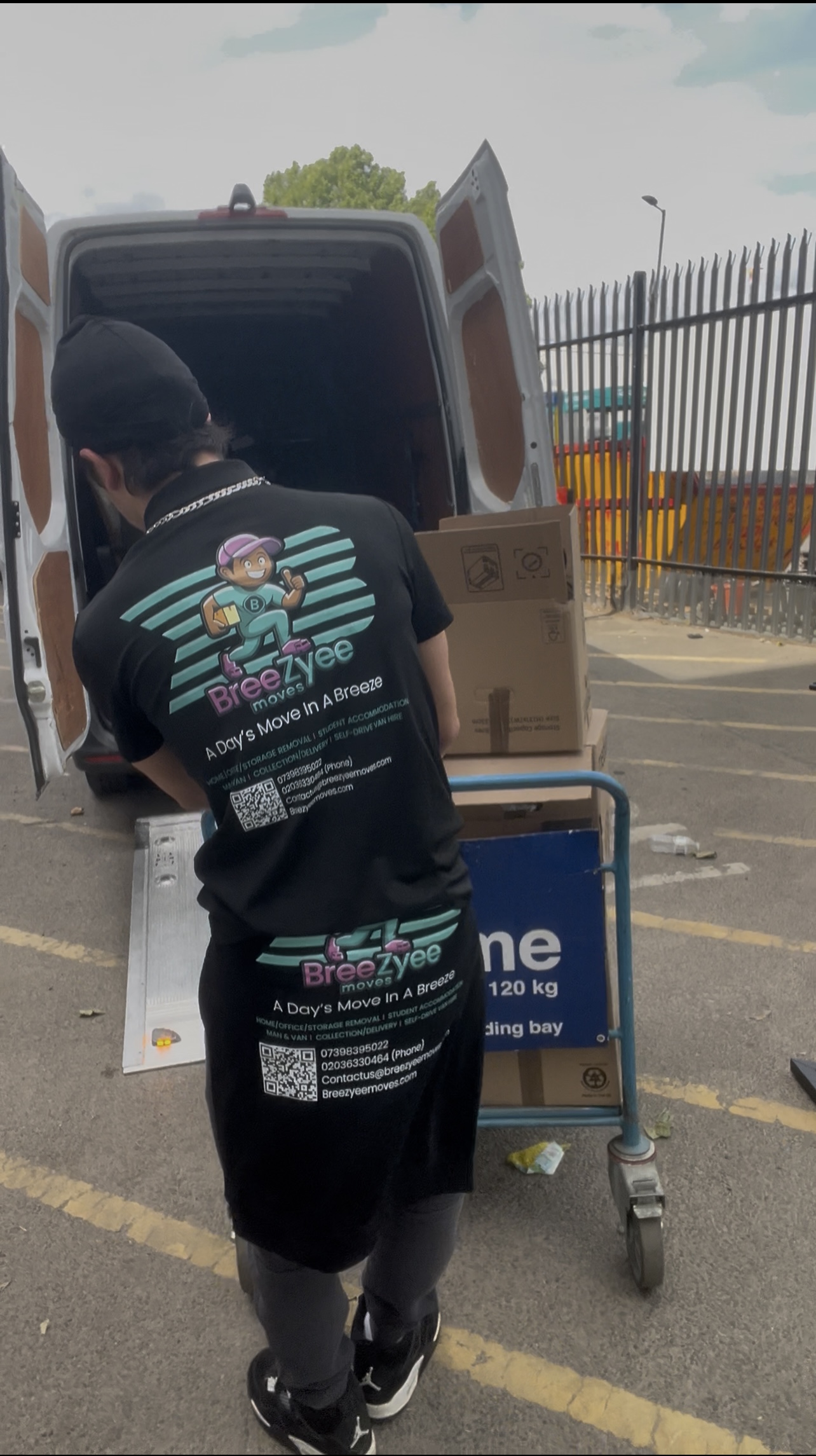 Professional team loading with trolleys and equipment