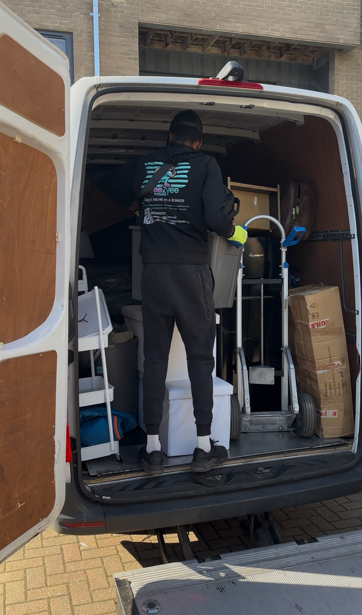 Team member working inside moving van with professional organization