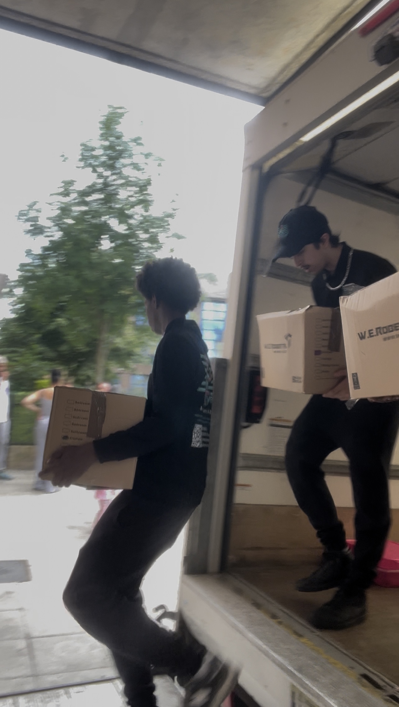 Team working together inside moving van